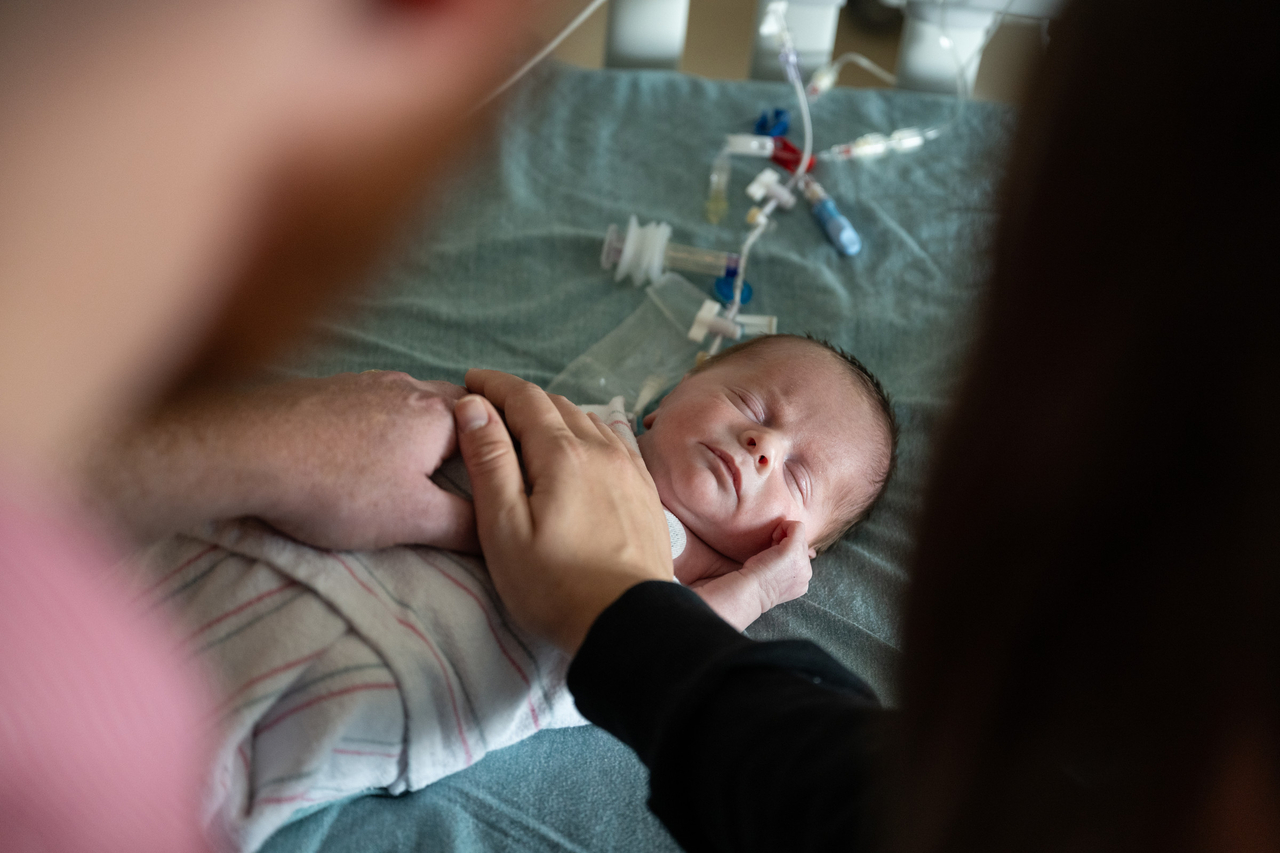 Parents holding baby